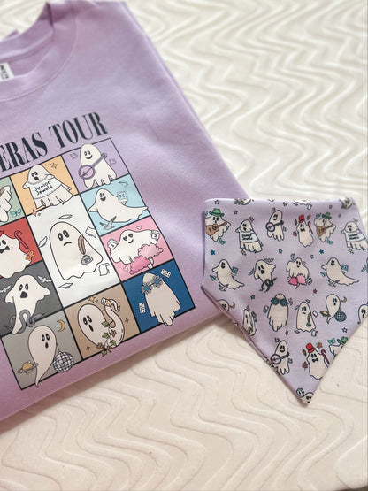 Purple t-shirt with cartoon ghost design and matching bandana on a textured surface.
