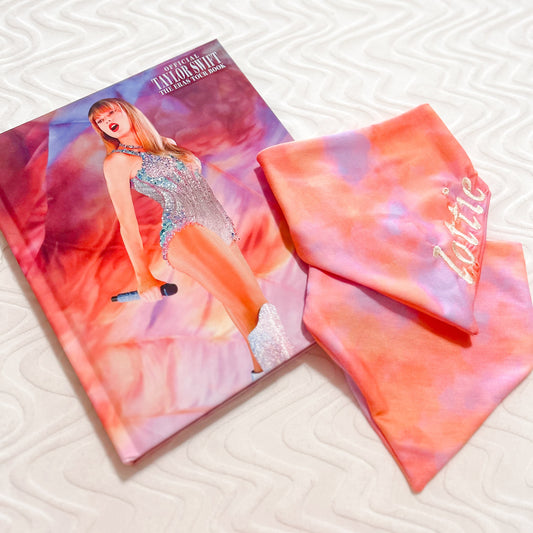 Tie-dye patterned product with a magazine featuring a model on a textured surface